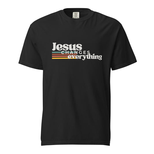 Front view of black women’s Christian T-shirt featuring the retro Jesus Changes Everything graphic with colorful stripes.