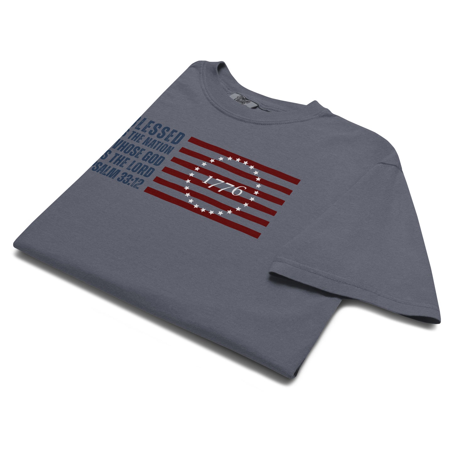 Folded Denim Blue Psalm 33:12 Men's Christian Patriotic T-Shirt with American Flag graphic.