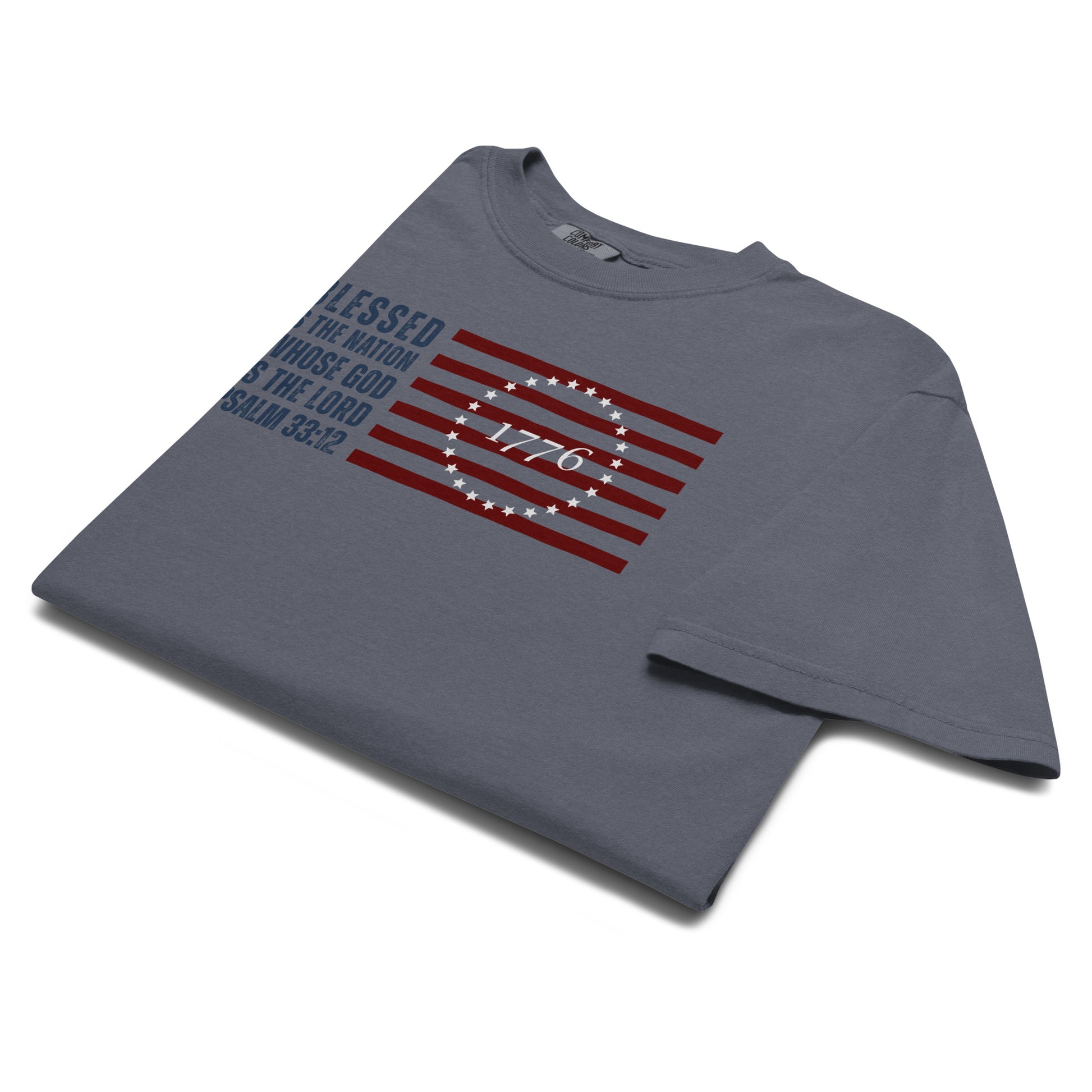 Folded Denim Blue Psalm 33:12 Men's Christian Patriotic T-Shirt with American Flag graphic.