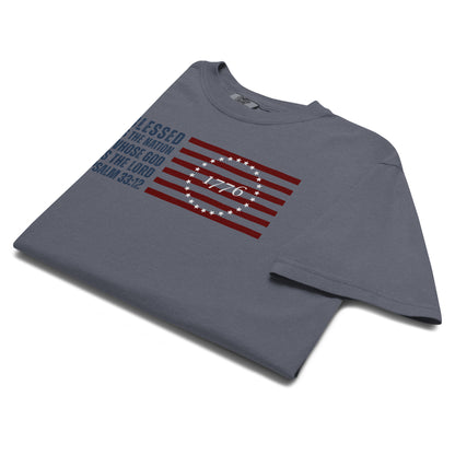 Folded Denim Blue Psalm 33:12 Men's Christian Patriotic T-Shirt with American Flag graphic.