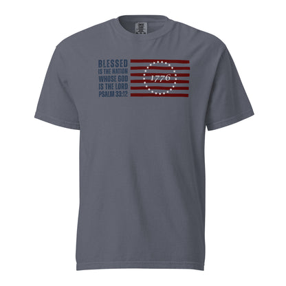 Front of denim blue men’s Christian T-shirt featuring Psalm 33:12, an American flag, and 1776.