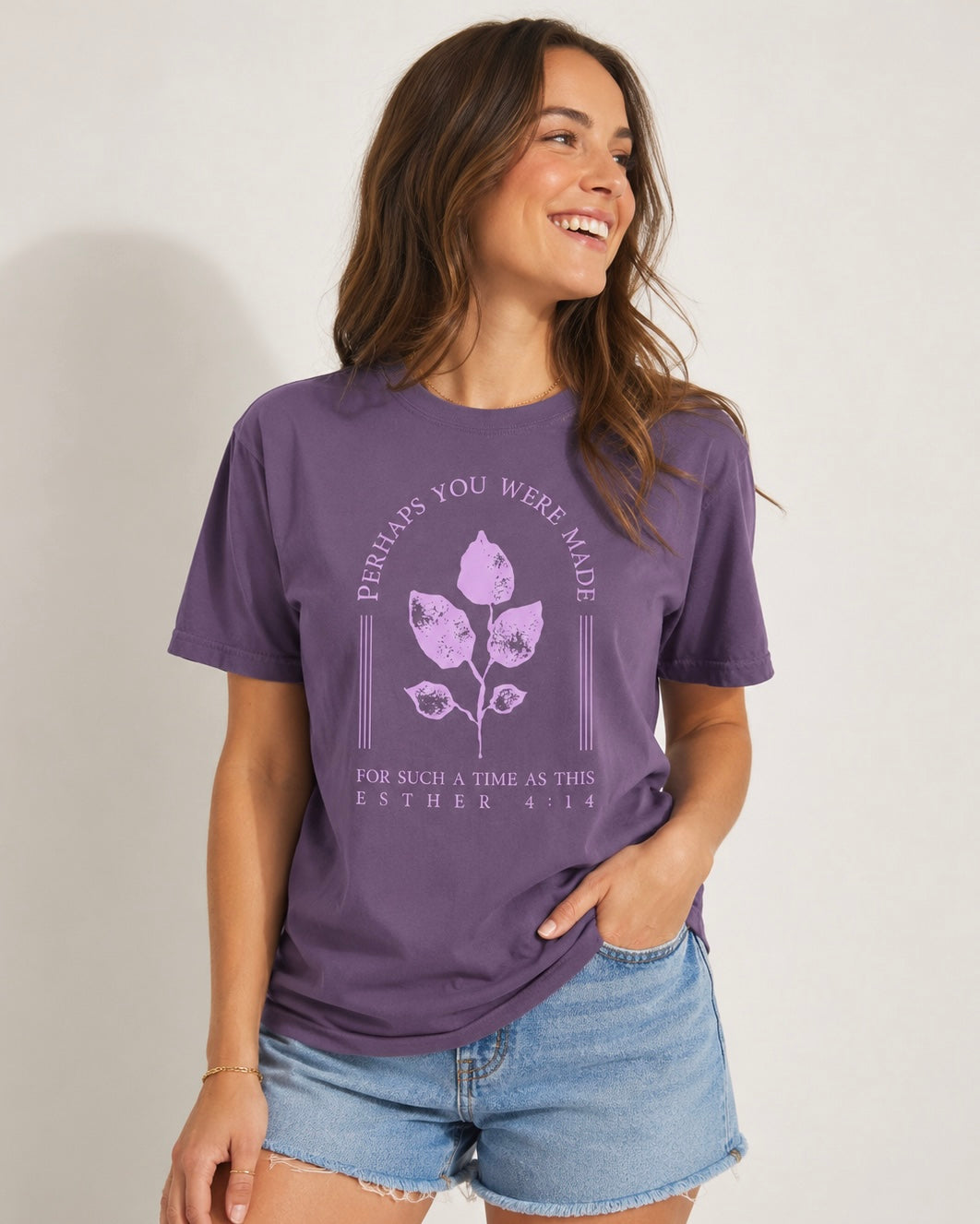 Joyful woman wearing a purple “For Such a Time as This” Esther 4:14 Christian graphic T-shirt.