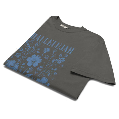 Angled close-up of the pepper Hallelujah T-shirt with blue floral Christian graphic