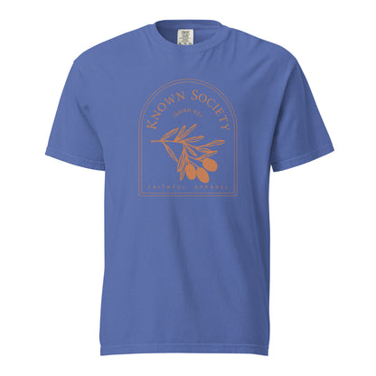 Mystic blue Known Society women’s Christian T-shirt featuring an orange Isaiah 43:1 olive branch graphic.