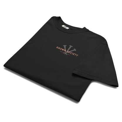 Folded black Known Society Christian T-shirt showing the three-nail logo and Isaiah 43:1 chest design.