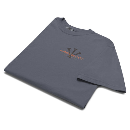Folded denim blue Known Society Christian T-shirt featuring the three-nail logo and Isaiah 43:1 chest print.