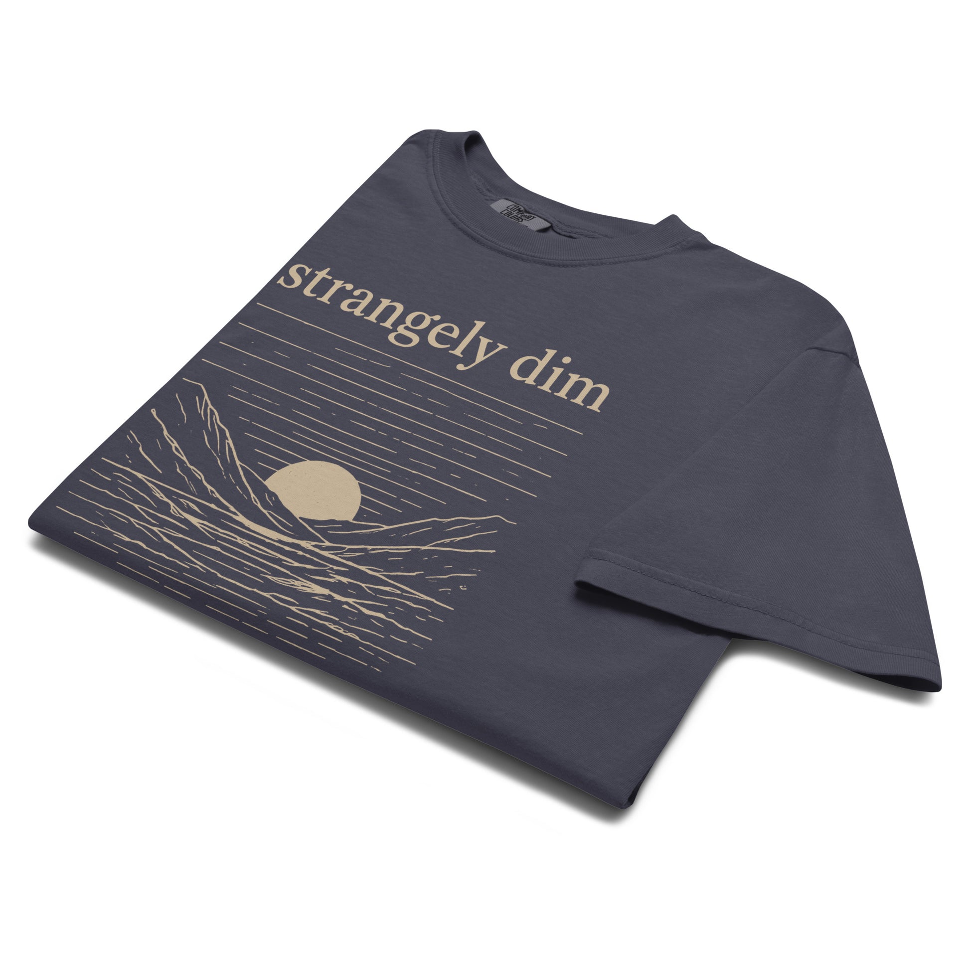 Angled close-up of navy Strangely Dim men’s Christian graphic tee with mountain and sunset artwork