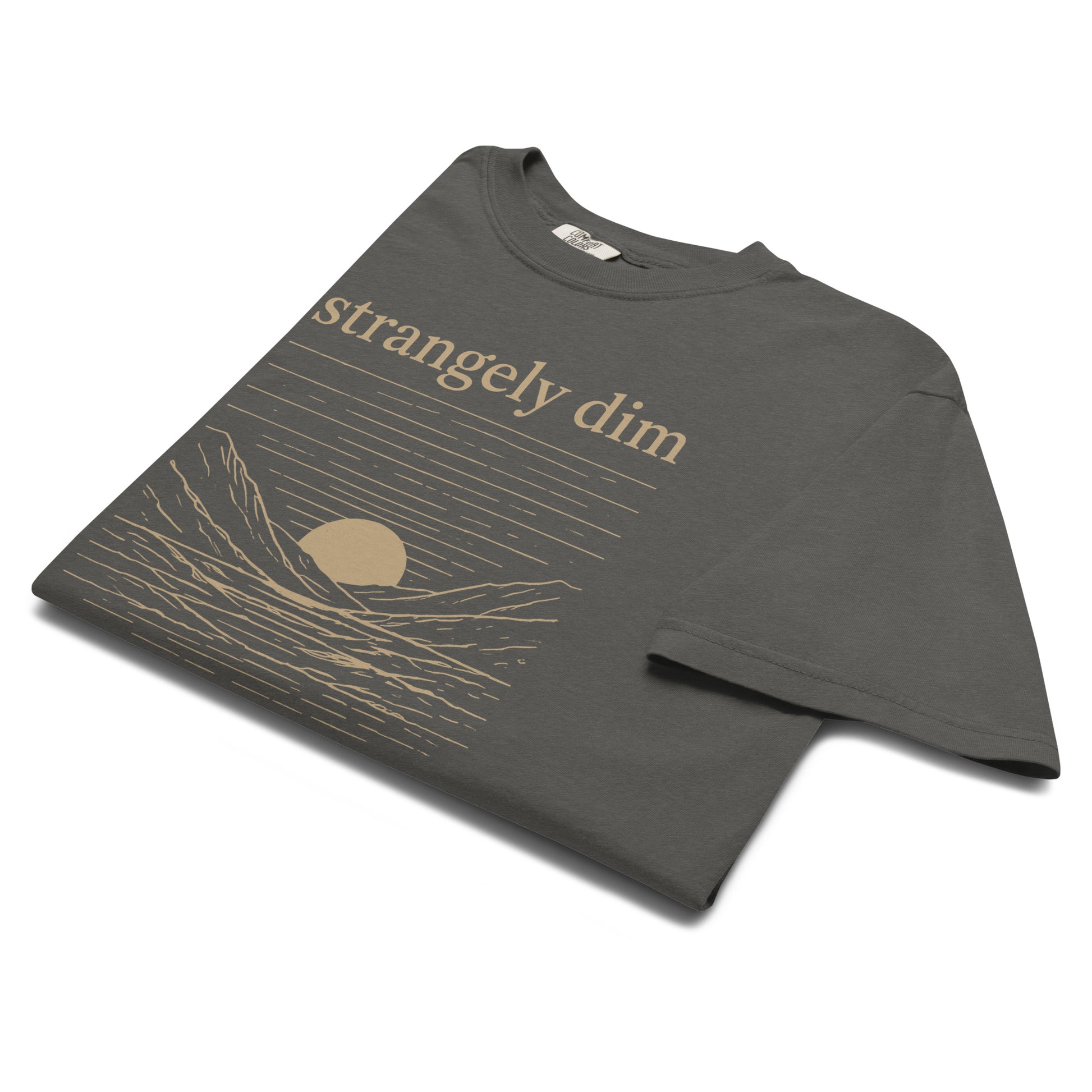 Angled close-up of pepper gray Strangely Dim Christian graphic tee with vintage landscape design