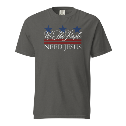 Pepper gray women’s T-shirt with a red, white and blue We the People Need Jesus design.