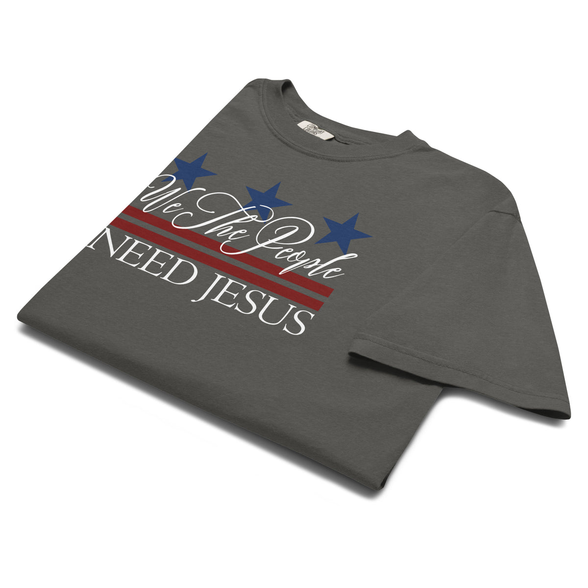 Angled view of the pepper We the People Need Jesus patriotic Christian graphic T-shirt.